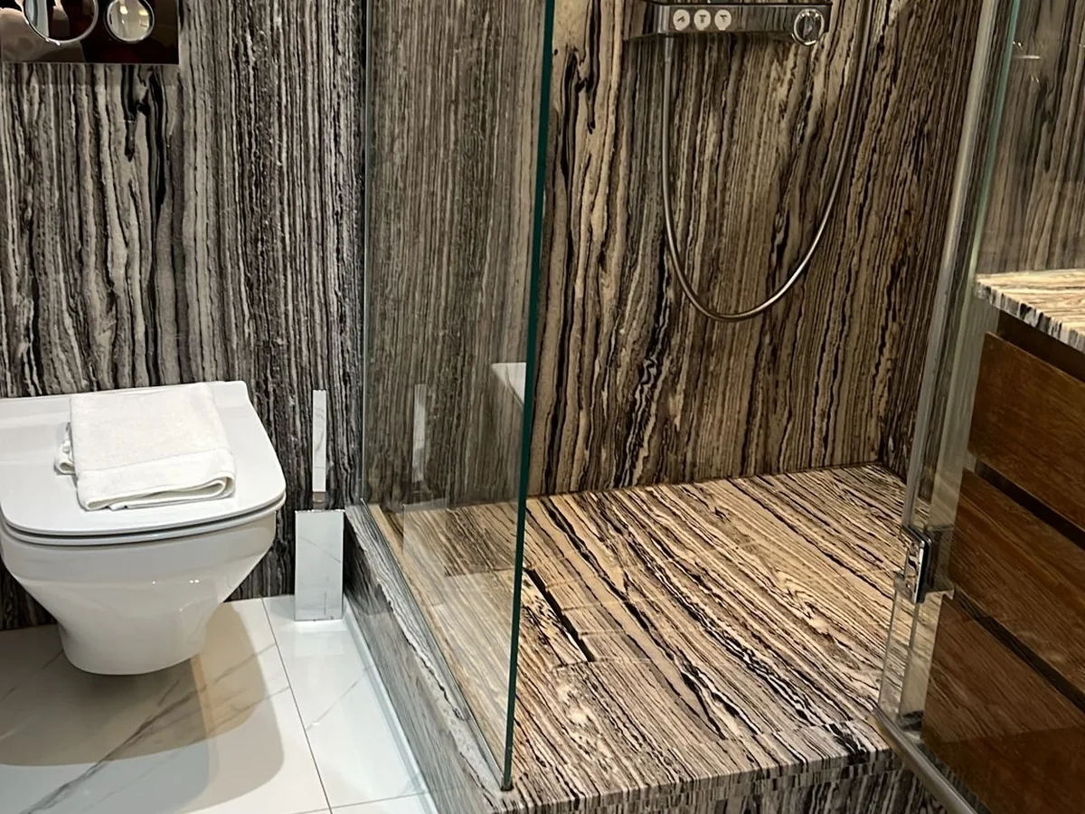 Spotless marble shower and bathroom after an end of tenancy clean